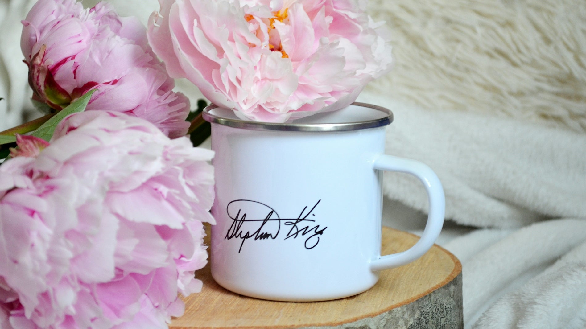 white ceramic mug on brown wooden table