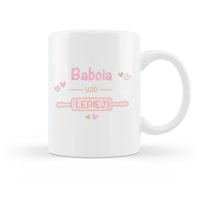 Biała filiżanka z napisem 'Babcia wie lepiej' w różowych kolorach, idealny personalizowany prezent dla babci