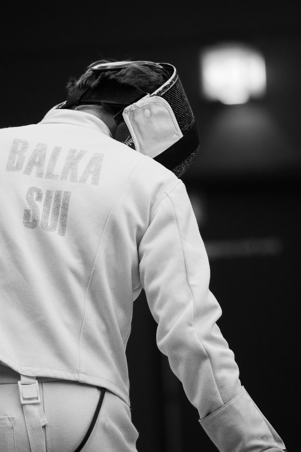 a black and white photo of a person wearing a jacket
