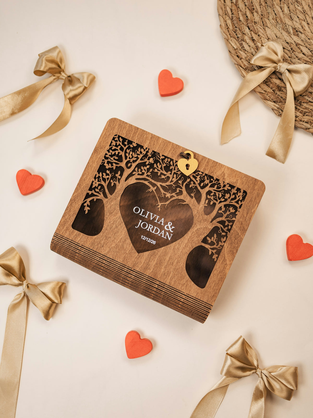 A wooden box with a tree and hearts on it